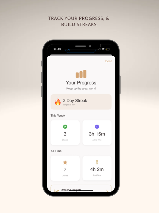 Close-up of smartphone showing logged Pilates workout and streak progress.