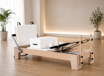 white studio reformer, with oak wood, microfibre leather, fitness studio, slates space, home
